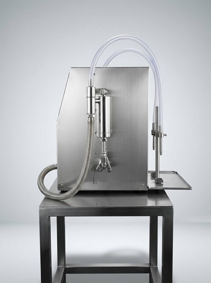 Volumetric liquid filling machine, side view